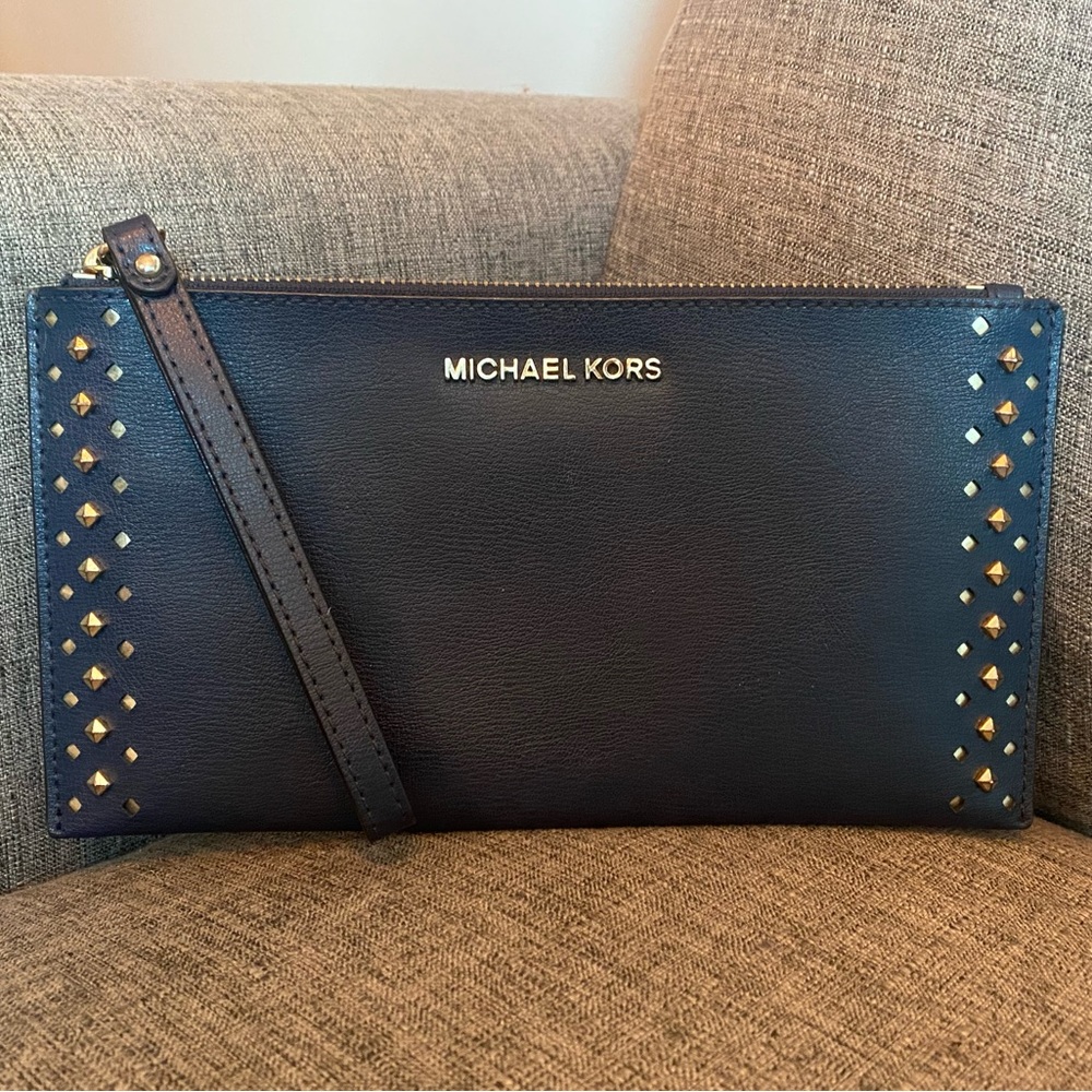 Navy Michael kors clutch/wristlet with gold accents, pocket and six card slots